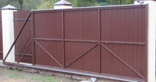 Купить откатные ворота из профнастила Вольск, цена от 1771 руб.